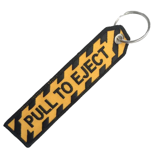 PULL TO EJECT BLACK AND GOLD KEYCHAIN